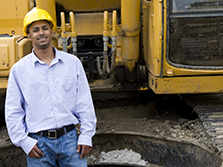 An heavy equipment operators smiles on site of his road construction career in georgia 