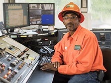 An asphalt plant operator sits at his desk on site of his road construction career in Georgia