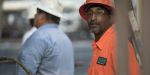 Highway construction worker in Georgia smiles on site of his Georgia road job.