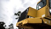 Yellow heavy equipment machinery sits on site of a Georgia road jobs project