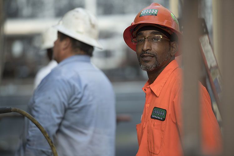 Highway construction worker in Georgia smiles on site of his Georgia road job.