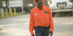 Emmitt Hall, a highway construction worker, wears a orange shirt on site of his road job in Georgia