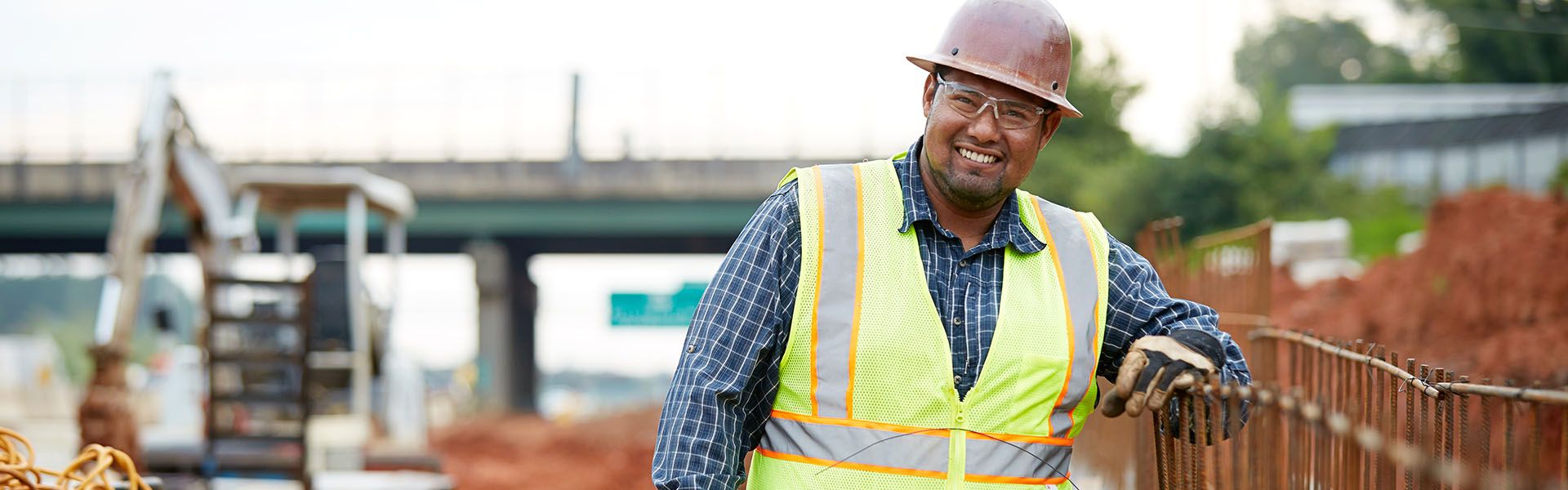 Luis Cervantes, a road construction worker smiles on site of his Georgia road job