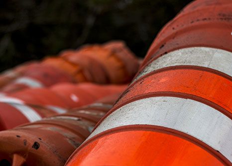 A pile of neon orange construction cones used on site of many road construction programs in Georgia