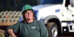 Melinda Vanhook is a CDL driver who works for a Georgia highway contractor. She smiles on her job site.