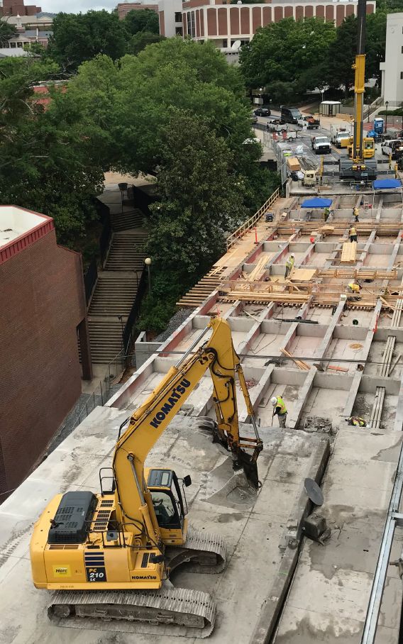 A crane on site of a Georgia road construction project removes old concrete.